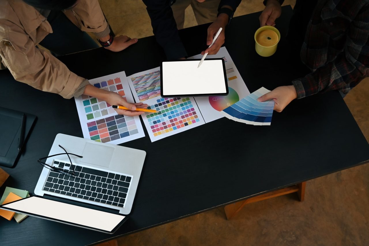 overhead-view-team-of-graphic-designer-working-with-color-chart-and-brainstorming-for-new-project-.jpg
